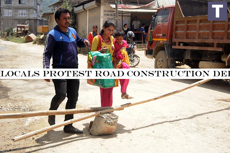 Locals protest road construction delay