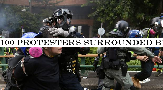 100 protesters surrounded by police at Hong Kong university