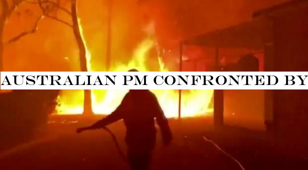 Australian PM confronted by angry residents on visit to wildfire-ravaged town