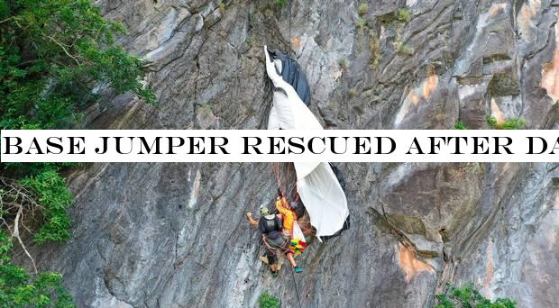 Base jumper rescued after dangling for hours from parachute caught on cliff side